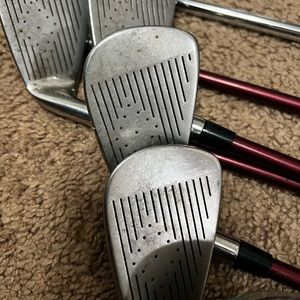 Wilson Fire sticks. Wilson 55 wedge. Hopkins 62 wedge. Putter. Hybrid and 4i